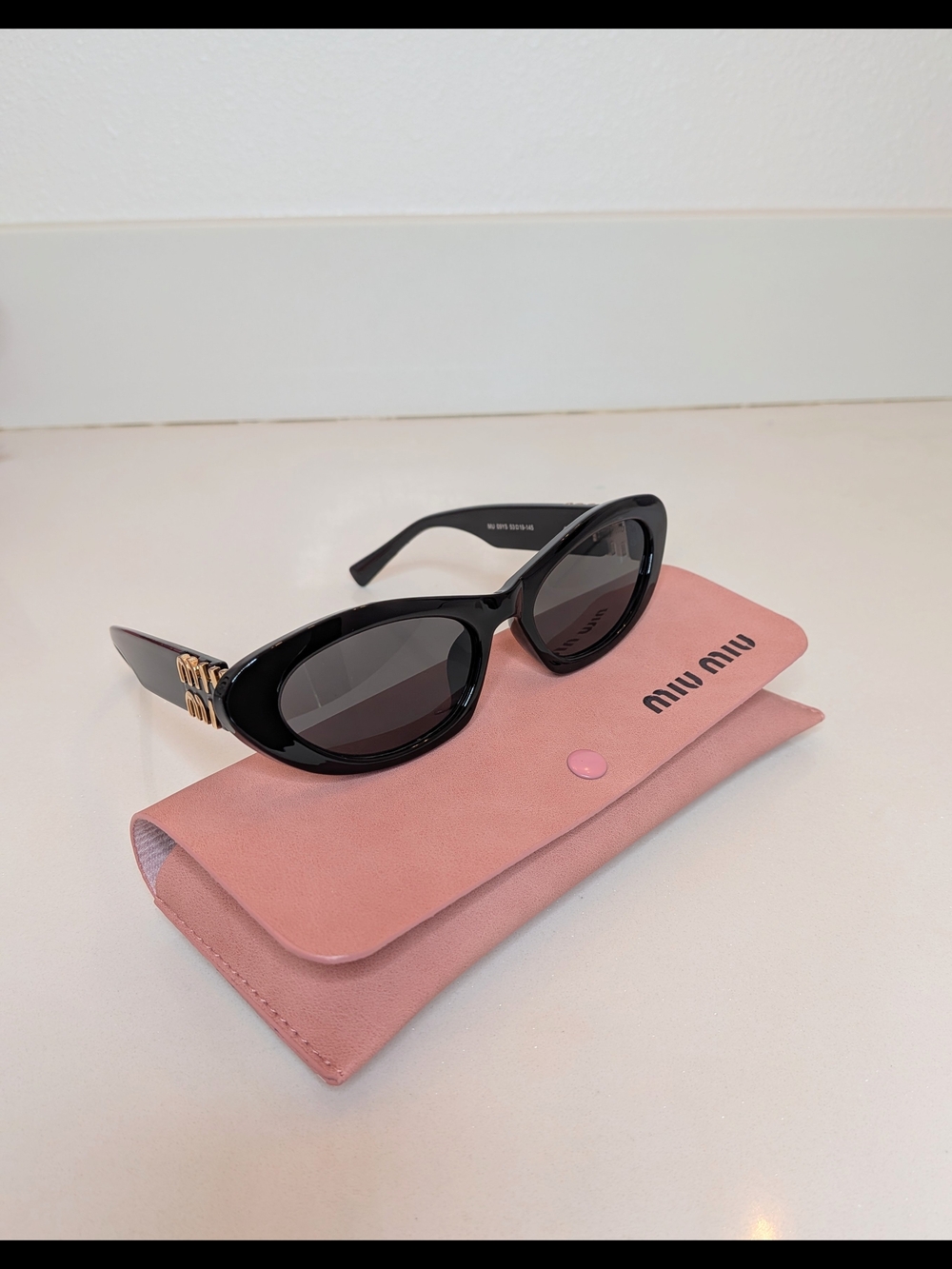 Miu Miu Women's Black Oval Cat Eye Sunglasses - Picture 3 of 13